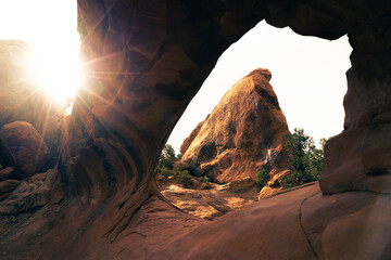 viewh on sandstone rock through sandstone arch in arhes national park  - obrazy, fototapety, plakaty