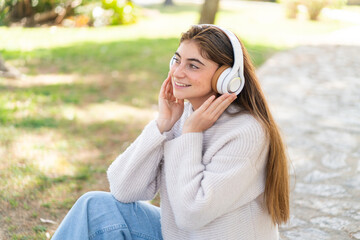 Young pretty caucasian woman listening music