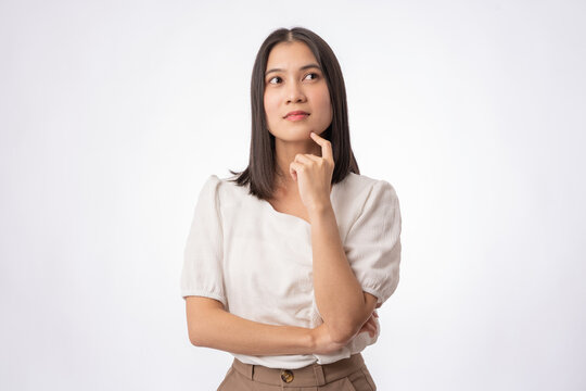 portrait asian young woman questioning and looking away isolated on background