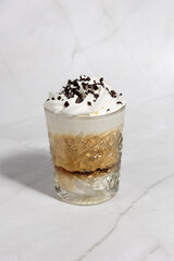 Coffee served in a glass with cream