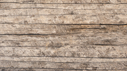 Weathered plank wooden material surface. Background and textured photo, close-up.