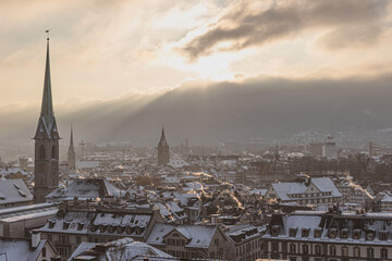 view of the city of Zurich covered in snow