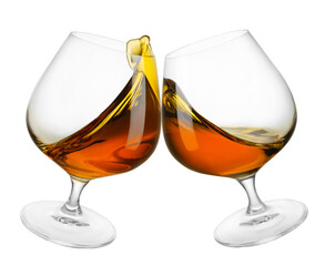two glasses of brandy in toasting gesture with splash isolated on white