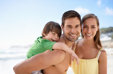 Fototapeta premium Beach, summer and portrait of a family on vacation, travel or fun trip with a smile. Man, woman and child or son together on holiday or adventure at sea with happiness, love and care on blue sky