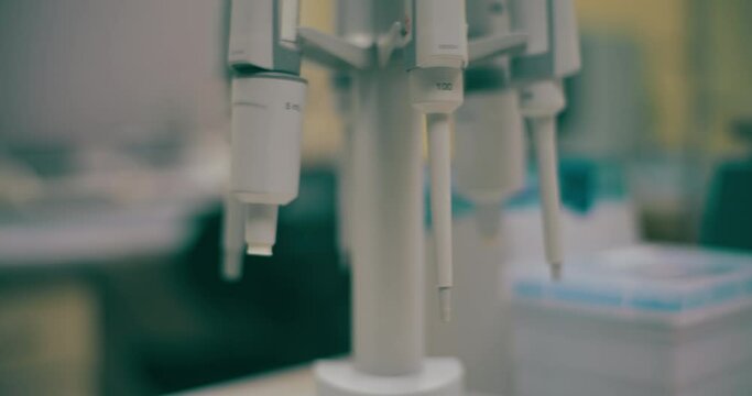 Scientist is conducting cancer research in laboratory.