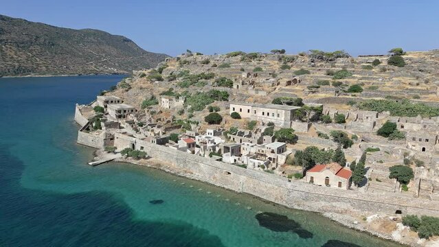 Drone view flying along the old Venetian fortress island of Spinalonga, Crete, Greece