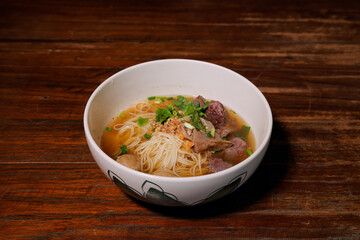 Savoring beef noodle soup local eatery food dish rustic setting close-up culinary delight