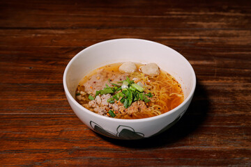 Savory noodle soup local eatery food photography rustic setting close-up culinary delights