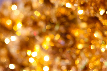 Abstract Blurred glitter color bokeh background, Bokeh abstract texture. Colorful Glitter sparkle. Defocused background. Blurred bright light. Gold glitter color.