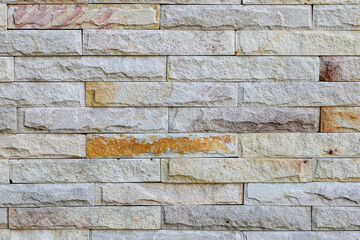 Gray ans brown grunge brick wall, abstract texture background, Grey brick wall with traces of destruction and dirty texture, decay old white brick wall, wide panorama of masonry, bricklaying.