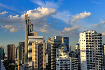 Cityscape skyline, Skyscrapers on CBD of Bangkok on sunny day with cloud on blue sky.
