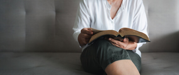 Woman hands praying to god with bible. Begging for forgiveness and believe in goodness. Christian...