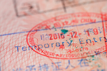 close-up part of page of document, foreign passport for travel with China visa, tourist visa stamp...