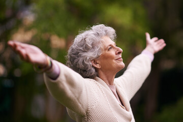 Senior, happy woman and celebrate life in nature, joy or retirement freedom outdoors. Face of...