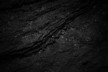 Dark gray black natural stone slab texture background with light grains