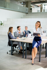 Young business woman with digital tablet in the office