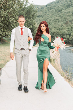 Young teenage couple dressed up for the prom, walking together