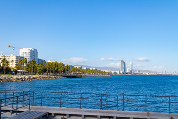 View of beautiful coast with promenade of Limassol, Cyprus from pier during spring sunny day.