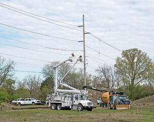 Electrical Workers Preparing to Replace 80 Foot Utility Pole © lawcain