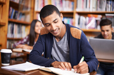 Study, writing and smile with man in library for education, research and classroom quiz. Focus,...