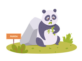 Cute panda eating bamboo leaf in zoo lawn, baby bear sitting on green grass near stone
