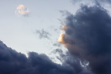 Thunder Sky. Cloudy clouds in the setting sun. A natural phenomenon. A natural phenomenon