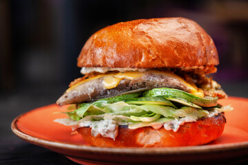 A large juicy fresh burger. The king of burgers.