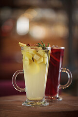 Fruit tea or mulled wine with berries in a glass cup