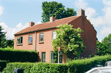 Fototapeta na wymiar Typical Dutch Home in The Netherlands on Kodak Gold Film