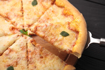 Italian or French pizza with different ingredients. Sausage, meat, cheese, tomatoes.