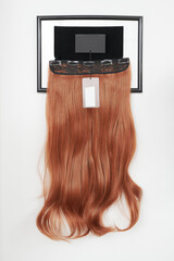natural looking wig brown color in beauty salon, hair on shelf in wig shop
