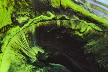 Abstract green color background. Multicolored fluid art. Waves, splashes and blots acrylic alcohol ink, paints under water