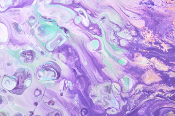 Multicolored creative abstract background. Lilac alcohol ink. Waves, stains, spots and strokes of paint, marble texture
