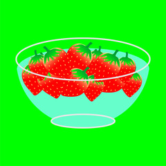 strawberry in a glass bowl with filled water on green background 