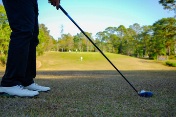 Golfer are playing game golf and hitting go on green grass mountain background
