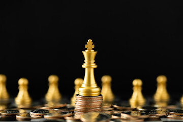 Stack of Coins with the Golden Chess character to represent It's time to do money saving for retirement planning as concept.