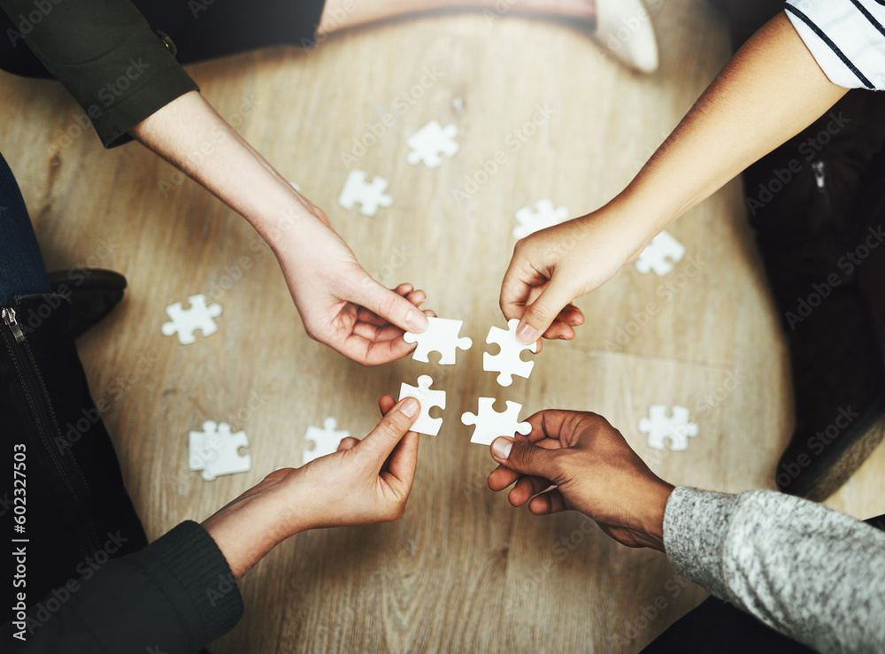 Poster Hands, business people and puzzle in circle, huddle or teamwork for problem solving, solution or game in top view. Group, together and helping with support, synergy and team building on office floor