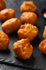 Battered chicken balls with tomato ketchup, party finger food concept