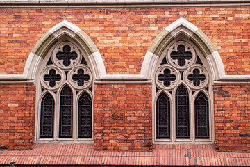 gothic church windows in orange bricks 