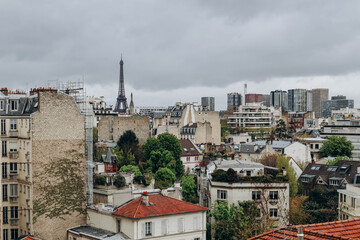 View of the Parisian rooftops and the Eiffel Tower from the 16th arrondissement of Paris - obrazy, fototapety, plakaty