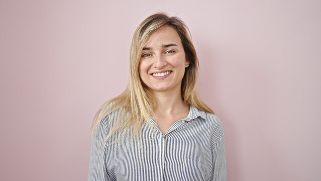 Young Blonde Woman Smiling Confident Standing Over Isolated Pink Background