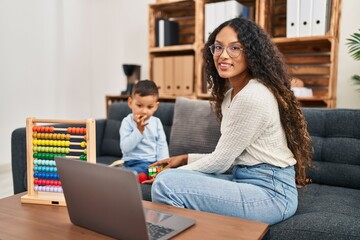 Mother and son having educational therapy at pedagogue center