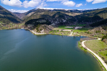 Obraz na płótnie Canvas Cubuk Lake in Goynuk District of Bolu, Turkey. Beautiful lake view with windmills. Shooting with drone.