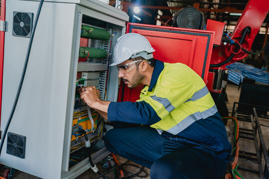 professional business industry technician wearing safety helmet working to maintenance service and checking factory equipment, a work of engineer occupation in manufacturing construction technology