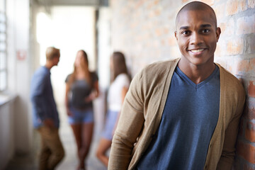 Education, university and portrait of black man with smile for motivation, knowledge and learning. College, academy scholarship and male student with friends on campus for studying, class and school