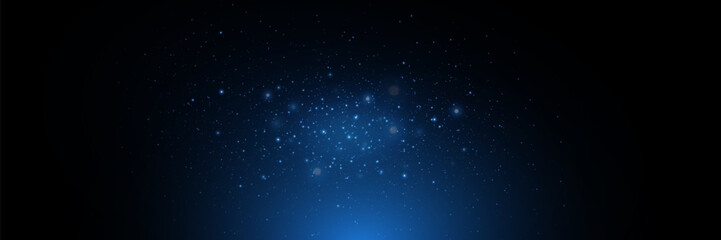 Naklejka na ściany i meble Blue particles of light, shining stars, dust, glitter. On a black background.