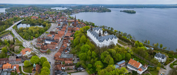 Aerial around the old town of the city Plön on a sunny spring day