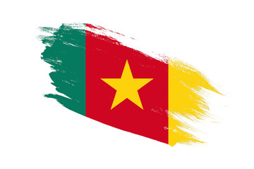 Cameroon flag with stroke brush painted effects on isolated white background