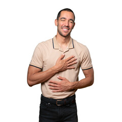 Happy young man laughing against background