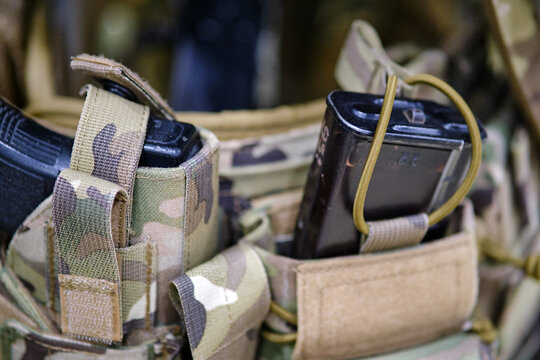 Army pouches and a holster with weapons for military uniforms. Bags for items and cartridges for the machine